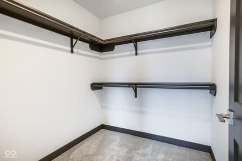 Bedroom at 18808 Cromarty Circle, Noblesville, IN — Spacious walk-in closet with organized shelving system.