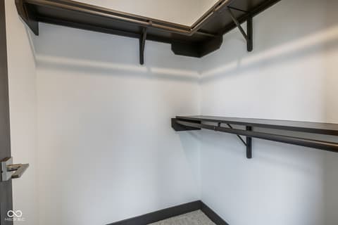 Bedroom at 18808 Cromarty Circle, Noblesville, IN — Spacious walk-in closet with modern shelving and rod system.