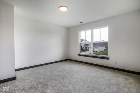 Bedroom at 18808 Cromarty Circle, Noblesville, IN — Bright bedroom with large windows and clean modern finishes.