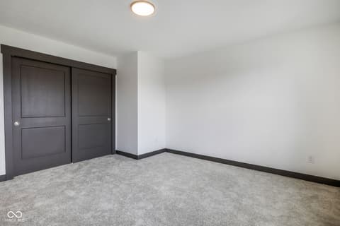 Bedroom at 18808 Cromarty Circle, Noblesville, IN — Spacious bedroom with modern closet and recessed lighting.