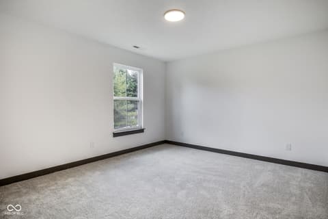 Bedroom at 18808 Cromarty Circle, Noblesville, IN — Bright bedroom with large windows and modern finishes.