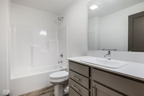 Primary bathroom at 18808 Cromarty Circle, Noblesville, IN — Spa-like primary bath with double vanity and shower.