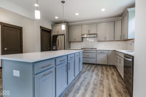Kitchen at 18808 Cromarty Circle, Noblesville, IN — Modern kitchen with elegant two-tone cabinetry and island.