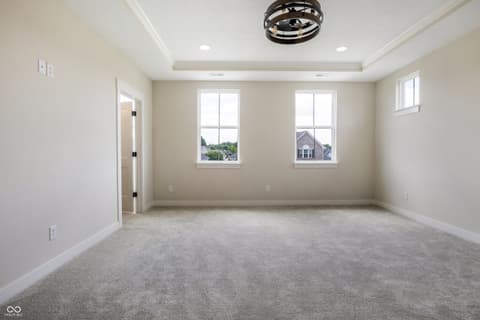 Bonus room at 18802 Cromarty Circle, Noblesville, IN — Bright bonus room with tray ceiling and modern finishes.