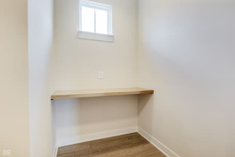 Home office at 18802 Cromarty Circle, Noblesville, IN — Bright office nook with built-in floating shelf.