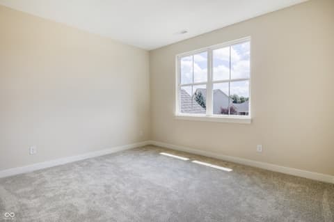 Bedroom at 18802 Cromarty Circle, Noblesville, IN — Bright bedroom with large windows and neutral finishes.