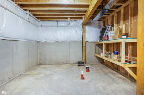 Basement at 18802 Cromarty Circle, Noblesville, IN — Unfinished basement with framing and storage potential.