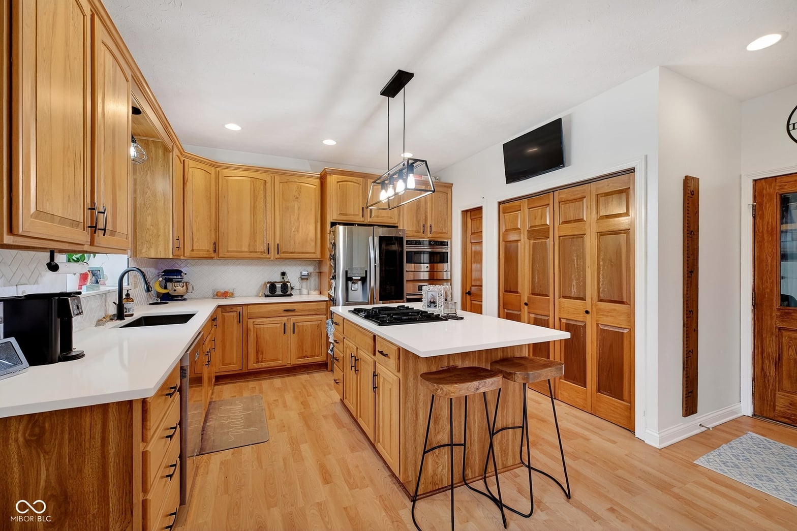 Spacious renovated kitchen with island and premium appliances.