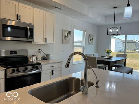 Kitchen at 876 Garrow Drive, Westfield, IN — Bright open kitchen with modern finishes and mountain views.
