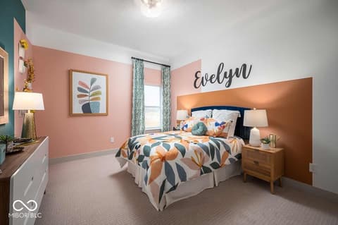 Bedroom at 11388 Selsey Road, Fishers, IN — Stylish bedroom with copper accent wall and modern decor.