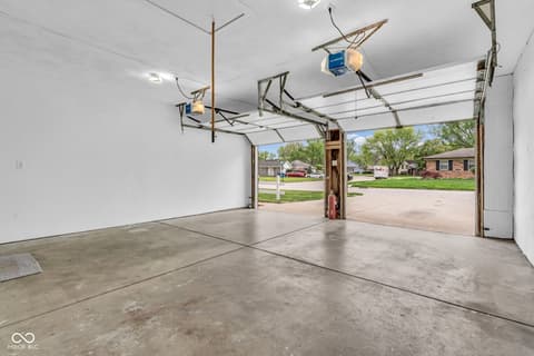 Garage at 18 Wilson Drive, Carmel, IN — Spacious two-car garage with bright, clean interior.