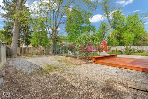 Yard at 18 Wilson Drive, Carmel, IN — Spacious yard with mature trees and rustic charm.