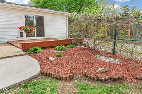 Backyard at 18 Wilson Drive, Carmel, IN — Spacious backyard with deck and fenced area.