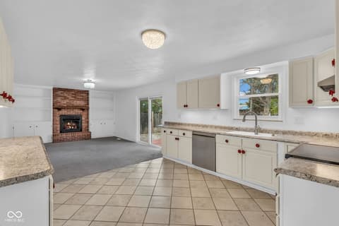 Kitchen at 18 Wilson Drive, Carmel, IN — Bright kitchen with granite counters and ocean views.