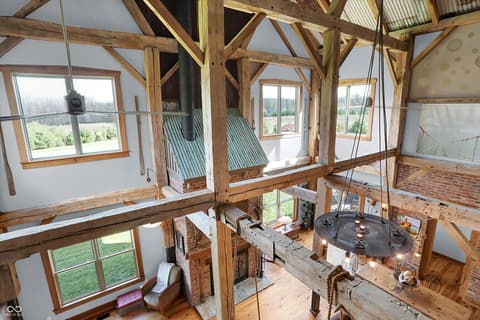 Bonus room at 25811 State Road 19, Arcadia, IN — Dramatic open-concept barn loft with soaring timber beams.