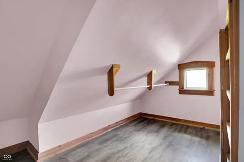 Bedroom at 25811 State Road 19, Arcadia, IN — Bright attic bedroom with vaulted ceilings and skylights.