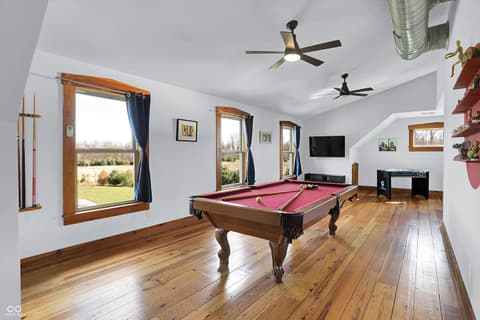 Bonus room at 25811 State Road 19, Arcadia, IN — Spacious recreation room with pool table and scenic views.