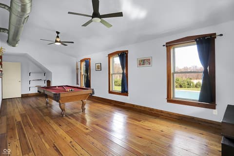 Bonus room at 25811 State Road 19, Arcadia, IN — Spacious bonus room with pool table and scenic views.