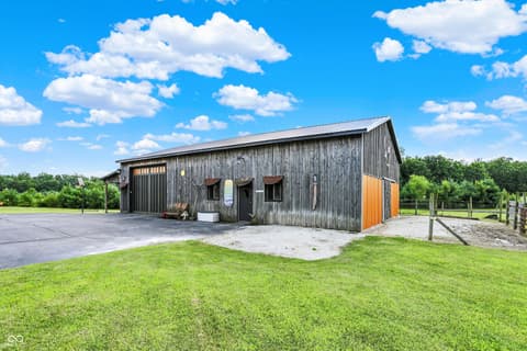 Front exterior at 25811 State Road 19, Arcadia, IN — Rustic metal barn on spacious rural property with pasture