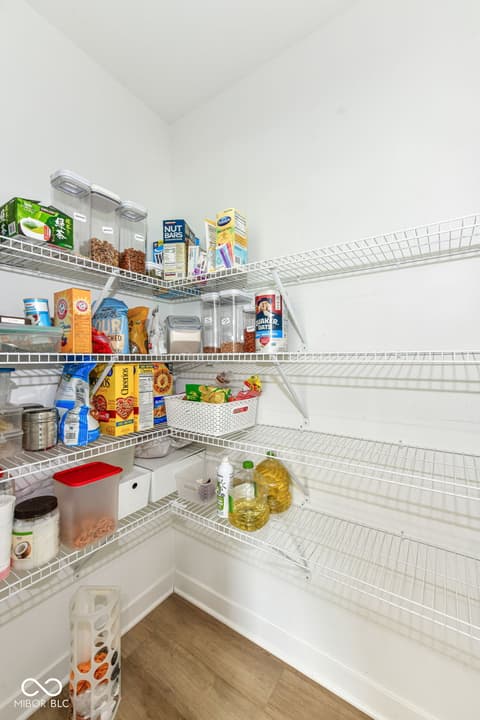Kitchen at 17267 Hanningfield Way, Westfield, IN — Well-organized pantry with ample wire shelving storage.