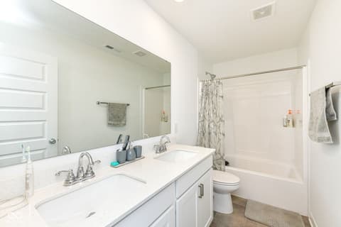 Primary bathroom at 17267 Hanningfield Way, Westfield, IN — Spacious primary bath with dual vanity and soaking tub.