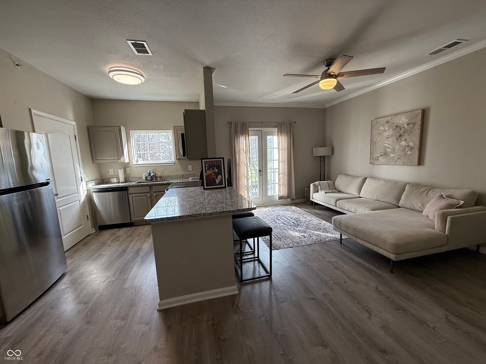Bright open-concept kitchen and family room with modern finishes.