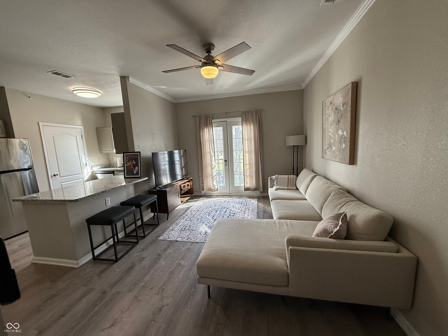 Open concept living with updated kitchen and modern finishes.