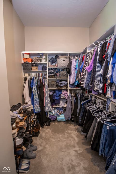 Bonus room at 15487 Heatherbank Drive, Westfield, IN — Spacious walk-in closet with extensive built-in shelving.