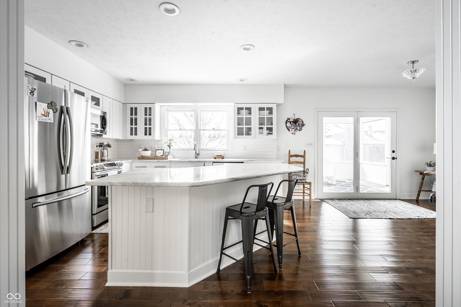 Bright, updated kitchen with island and quality finishes.