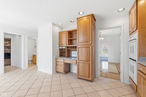 Kitchen at 15 Wildwood Drive, Carmel, IN — Spacious kitchen with custom wood cabinetry and open layout.