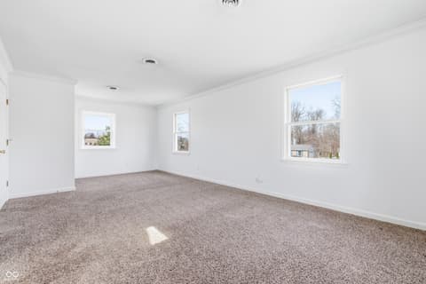 Bedroom at 15 Wildwood Drive, Carmel, IN — Bright, spacious bedroom with abundant natural light.