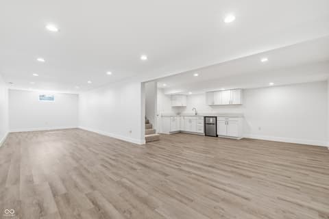 Basement at 15 Wildwood Drive, Carmel, IN — Bright finished basement with wet bar and modern amenities.