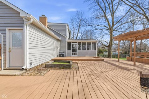 Backyard at 15 Wildwood Drive, Carmel, IN — Spacious composite deck with pergola and modern updates.