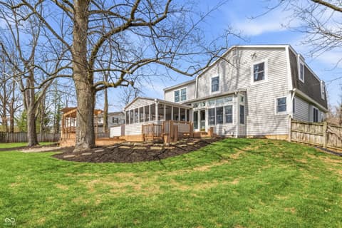 Backyard at 15 Wildwood Drive, Carmel, IN — Charming farmhouse with updated deck and screened porch.