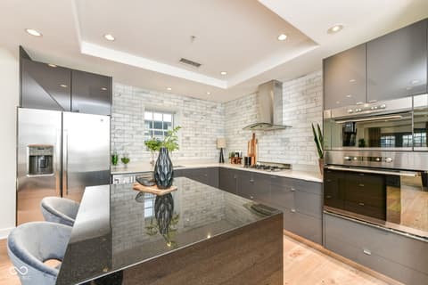 Kitchen at 30 W Main Street, Carmel, IN — Modern kitchen with premium appliances and island seating.