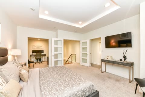 Primary bedroom at 30 W Main Street, Carmel, IN — Luxurious primary suite with spa-like ensuite access