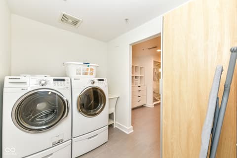 Laundry room at 30 W Main Street, Carmel, IN — Modern laundry room with premium front-load appliances