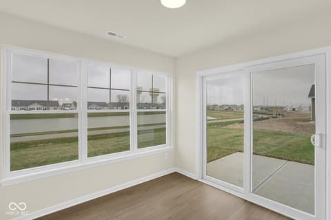 Bonus room at 19537 Atwater Avenue, Sheridan, IN — Bright bonus room with expansive views and glass doors.
