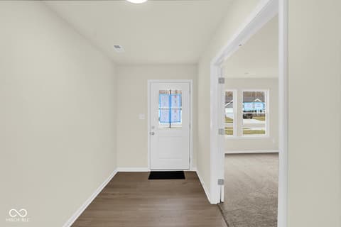Foyer at 19537 Atwater Avenue, Sheridan, IN — Bright, clean foyer with hardwood floors and natural light.