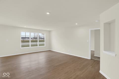Living room at 19537 Atwater Avenue, Sheridan, IN — Bright contemporary living space with expansive windows.