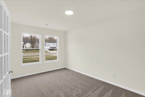 Bedroom at 19537 Atwater Avenue, Sheridan, IN — Bright bedroom with expansive windows and fresh finishes.