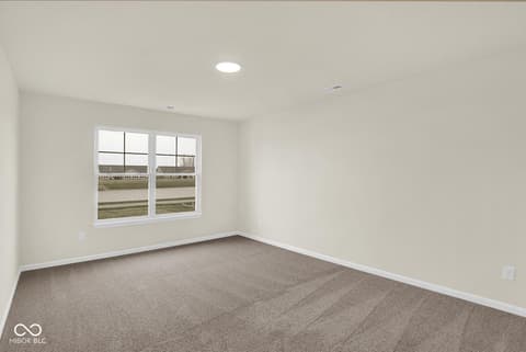 Bedroom at 19537 Atwater Avenue, Sheridan, IN — Bright bedroom with expansive windows and modern finishes.