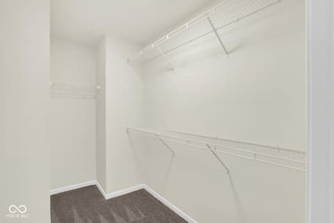 Primary bedroom at 19537 Atwater Avenue, Sheridan, IN — Spacious walk-in closet with organized wire shelving.