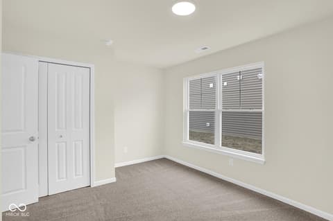 Bedroom at 19537 Atwater Avenue, Sheridan, IN — Bright bedroom with large windows and spacious closet.