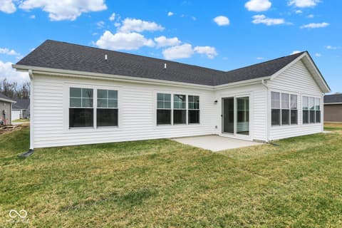Backyard at 19537 Atwater Avenue, Sheridan, IN — Bright new construction with expansive windows and patio.