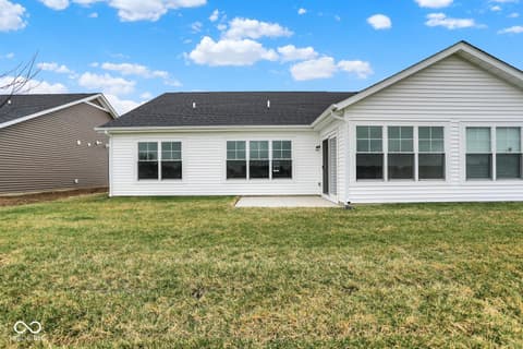 Backyard at 19537 Atwater Avenue, Sheridan, IN — Bright, modern home with expansive windows and open yard.