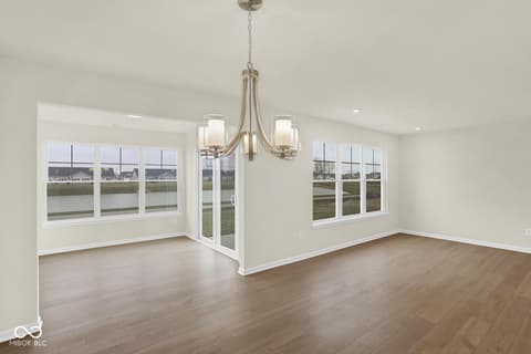 Living room at 19537 Atwater Avenue, Sheridan, IN — Bright open living space with abundant windows and doors.