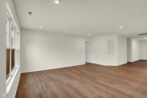 Family room at 19488 Atwater, Sheridan, IN — Bright, spacious open concept with premium hardwood floors.