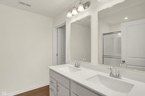 Primary bathroom at 19488 Atwater, Sheridan, IN — Luxurious primary bath with dual vanity and modern finishes.