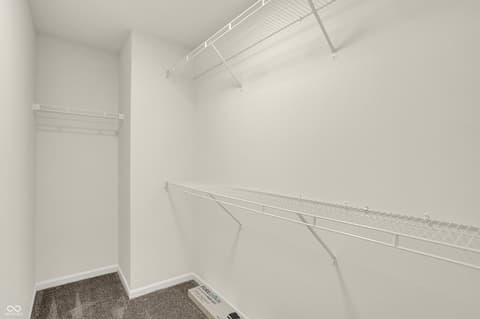 Bedroom at 19488 Atwater, Sheridan, IN — Spacious walk-in closet with organized wire shelving.